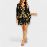 Linda - Působivé šaty s asymetrickými ramínky a potiskem kokosových palem